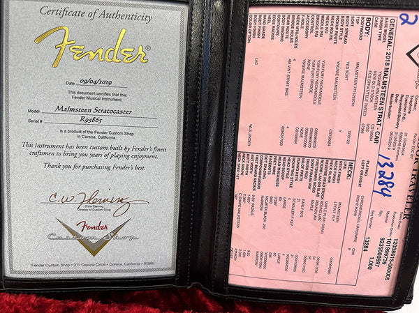Fender Certificate of Authenticity for Malmsteen Stratocaster guitar dated 09/04/2019 with serial number R95865 custom built by Fender Custom Shop in Corona California alongside detailed pink specification sheet for 2018 Malmsteen Strat guitar showing body, neck, and hardware details