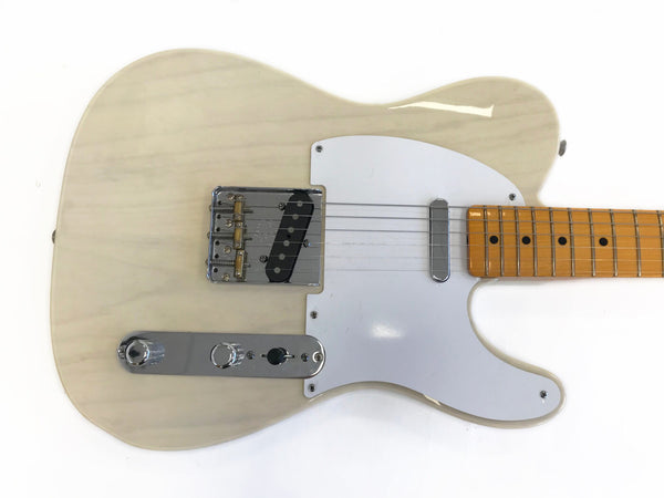 Cream finish electric guitar with white pickguard, single-coil pickups, maple fretboard, and chrome control plate