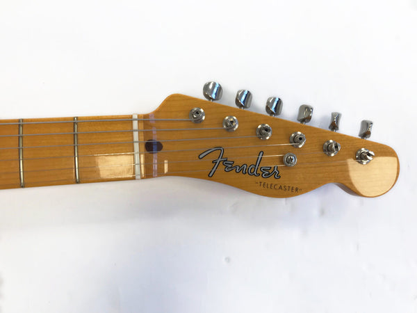 Close-up of Fender Telecaster guitar headstock with chrome tuning pegs and maple fretboard against white background
