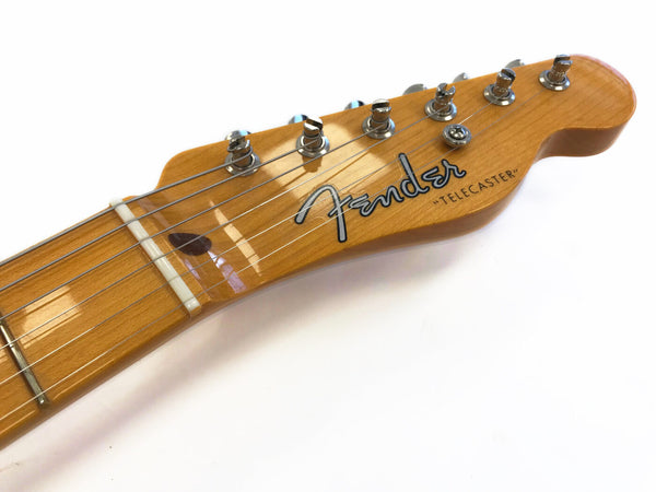 Close-up of Fender Telecaster electric guitar headstock with tuning pegs and strings on white background