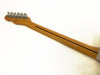 Back of maple guitar neck with dark wood stripe and six chrome tuning pegs on white background