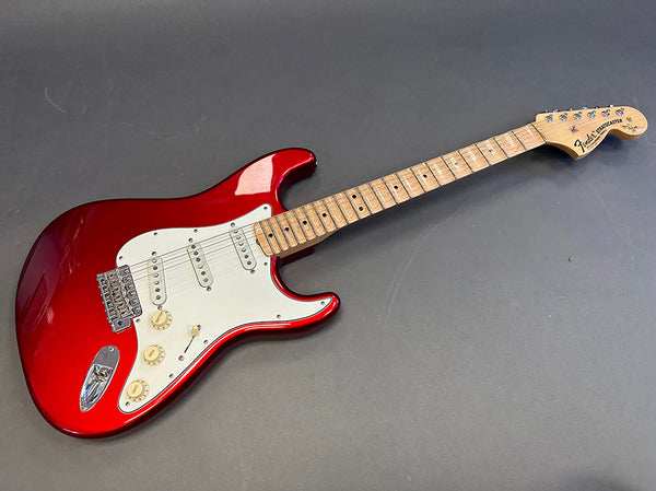 Fender Standard Stratocaster electric guitar in red with maple neck and white pickguard on gray background