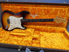 Fender Custom Shop sunburst electric guitar with white pickguard and rosewood fretboard in vintage orange plush lined hard case