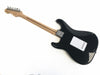 Back view of black electric guitar with maple neck, chrome tuning pegs, and white back plate on a white background