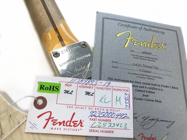 Close-up of Fender Limited Edition guitar neck plate with serial number CZ533423, Fender Certificate of Authenticity for Ltd Im Twisted Tele model dated 11/02/17, and Fender tag showing assembly and inspection details.