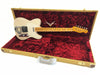Fender Telecaster electric guitar in vintage white finish with Bigsby tremolo, maple neck, and vintage tweed hard case with red plush interior lining.