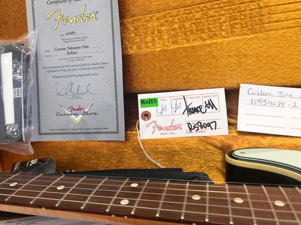 Fender Custom Telecaster Nos guitar certificate of authenticity and inspection tags in guitar case with rosewood fretboard and white binding guitar neck visible