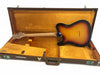 Back view of sunburst Fender Telecaster electric guitar inside vintage brown and gold plush lined Fender hard case.