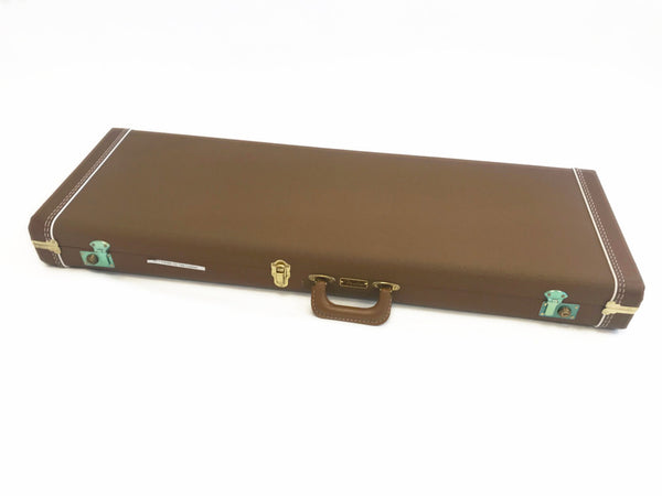 Brown hard shell guitar case with white stitching and gold latches designed for Fender CS Telecaster guitars