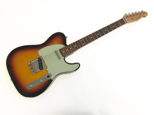 Fender Telecaster electric guitar in sunburst finish with maple neck and rosewood fretboard, vintage style single coil pickups, and classic pickguard on white background