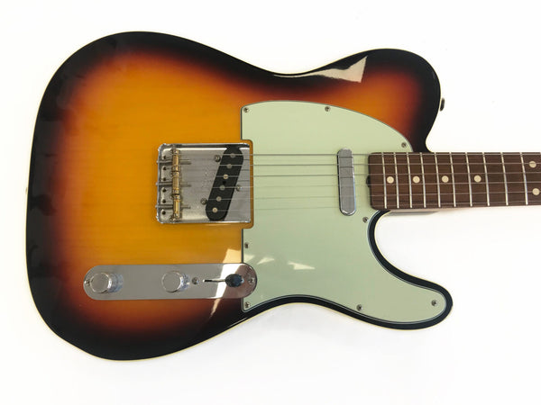 Sunburst electric guitar body with white pickguard and chrome hardware on white background