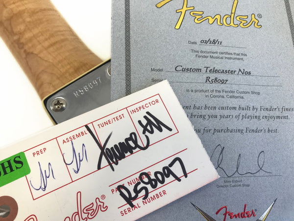 Fender Custom Telecaster NOS certificate of authenticity and inspection tag with serial number R58097 on guitar neck plate.