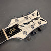 Close-up of white Gretsch guitar headstock with black logo and chrome tuning pegs on gray background