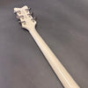 Back of white guitar neck and headstock with chrome tuning pegs on gray surface, Coffee House Guitars product listing image