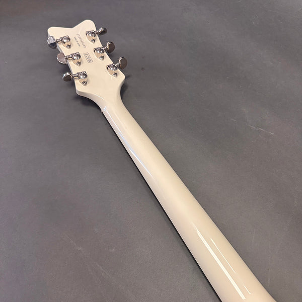 Back of white guitar neck and headstock with chrome tuning pegs on gray surface, Coffee House Guitars product listing image