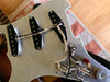 Vintage guitar pickguard with three single-coil pickups and wiring exposed, ideal for Stratocaster guitar repair or upgrade at Coffee House Guitars.