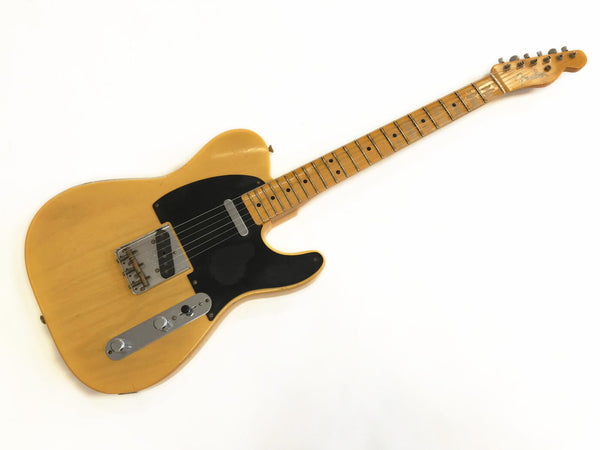 Vintage Fender Telecaster electric guitar with butterscotch blonde finish and black pickguard on white background