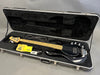 Black electric bass guitar with maple neck and fingerboard in open black hard case with cleaning cloth, cable, and accessory key inside Coffee House Guitars product listing