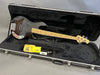 Ernie Ball Music Man StingRay 4-string electric bass guitar with maple neck and black body in black padded hard case with polishing cloth, guitar cable, and case key.