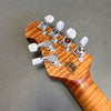 Close-up of guitar headstock with chrome tuning pegs and California Heritage logo on flamed maple wood neck