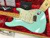 Fender Custom Shop vintage seafoam green Stratocaster electric guitar with maple neck and three single-coil pickups in red plush-lined hardshell case