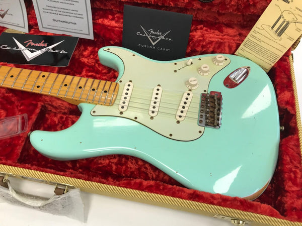 Fender Custom Shop vintage seafoam green Stratocaster electric guitar with maple neck and three single-coil pickups in red plush-lined hardshell case