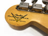 Close-up of Fender Custom Shop Limited Edition guitar headstock with vintage tuning machines on natural wood finish