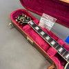 Gibson electric guitar neck and headstock with mother of pearl inlays in a plush pink lined brown guitar case with accessory bag