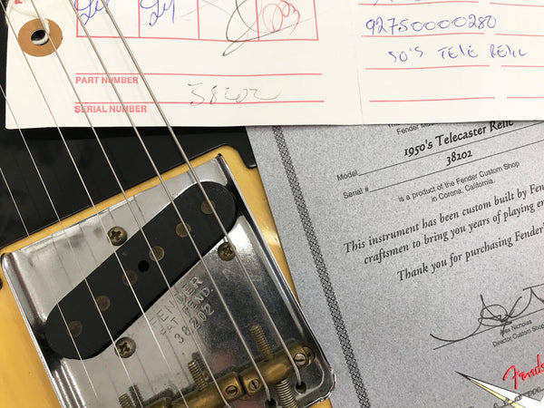 Close-up of Fender 1950's Telecaster Relic guitar bridge and pickup with serial number 38202 and Fender Custom Shop certificate