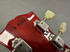 Close-up of Guitar Headstock Serial Number 9 3100 with Vintage Kluson Deluxe Tuning Pegs on Glossy Red Wood Finish