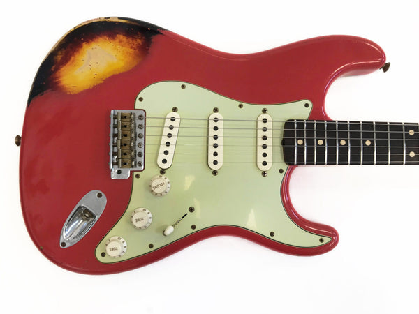 Vintage red electric guitar with three single-coil pickups, white pickguard, volume and tone knobs, and visible wear on the upper left body.