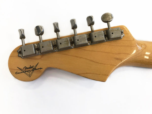 Vintage Fender Custom Shop guitar headstock with six vintage tuning pegs and natural wood finish