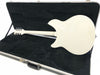 White electric guitar shown from the back inside a black plush-lined hard case with silver latches and handle, on a white background.