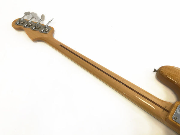 Maple neck and headstock of bass guitar with four tuning pegs and skunk stripe detail on neck from Coffee House Guitars.