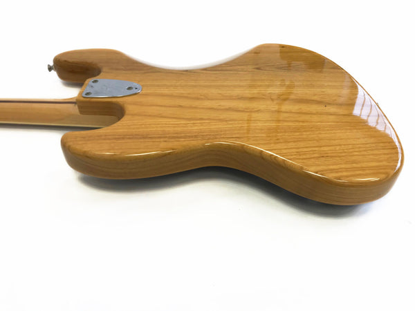 Glossy natural wood finish electric guitar body back with bolt-on neck plate on white background