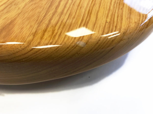 Close-up of guitar body wood grain and glossy finish detail on electric guitar at Coffee House Guitars