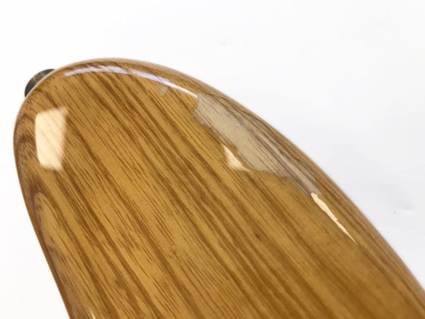 Close-up of guitar body with natural wood grain finish and glossy coating from Coffee House Guitars against white background