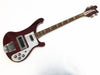 Rickenbacker electric bass guitar in dark red finish with white pickguard and vintage tuning pegs on white background