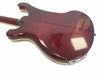 Back view of vintage maroon electric guitar body with cream binding and dark center stripe on white background