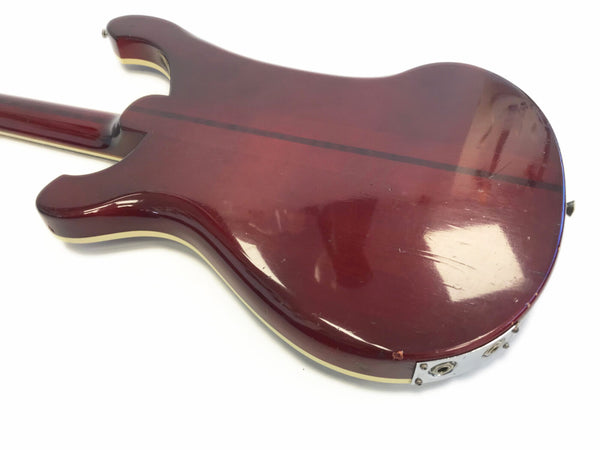 Back view of vintage maroon electric guitar body with cream binding and dark center stripe on white background
