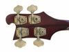 Close-up of vintage bass guitar headstock with four metal tuning pegs and dark reddish-brown finish against white background