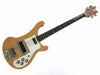 Vintage natural finish Greco electric bass guitar with four control knobs and chrome hardware, rosewood fretboard, and dual pickups on white pickguard isolated on white background.