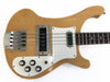 Natural finish electric bass guitar with chrome hardware, four control knobs, two pickups, and rosewood fretboard on white background