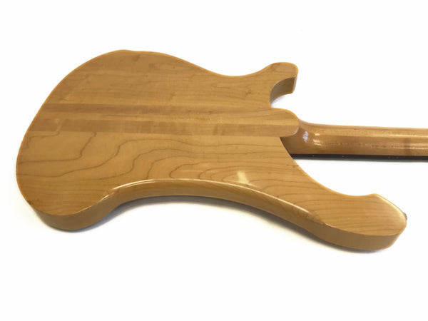 Back view of a natural wood electric guitar body with a smooth, glossy finish and visible wood grain patterns on a white background.