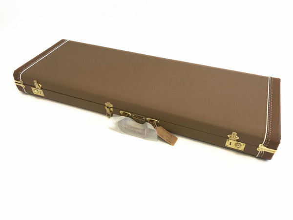 Brown rectangular guitar hard case with gold latches and handle, Fender logo on the front, designed for electric guitars, white stitching details.