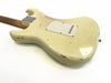Vintage cream-colored electric guitar body with worn and chipped finish showing relic wear, displaying the back side and neck joint plate on a white background.
