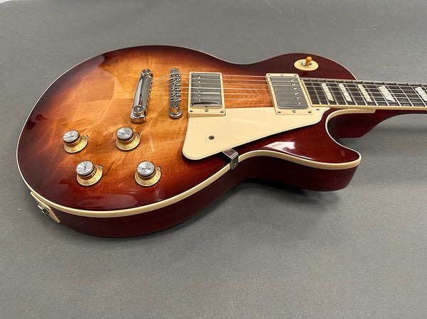 Sunburst electric guitar with humbucker pickups, cream pickguard, and vintage-style control knobs on gray background, Coffee House Guitars product listing image