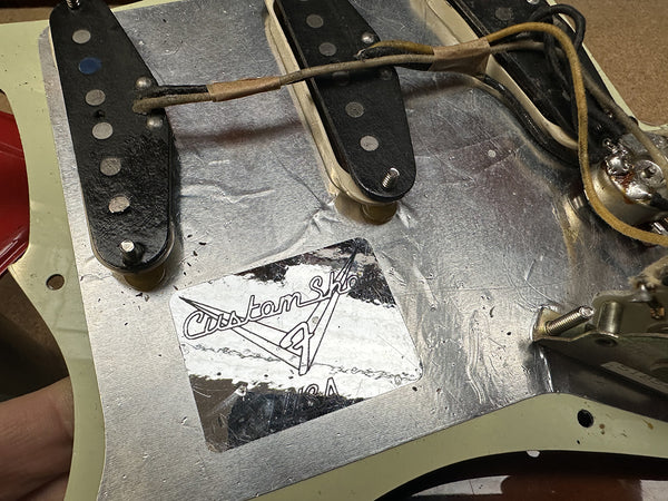 Vintage Fender Custom Shop guitar pickup cavity shielding with original label and wiring exposed