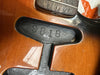 Close-up of guitar body cavity showing serial number 981B stamped inside with sunburst finish and wood grain visible near pickups