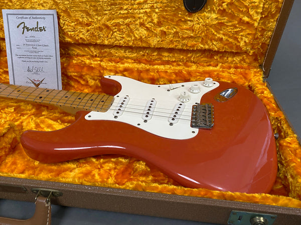 Fender '56 Stratocaster Closer Classic guitar in red finish with maple neck and white pickguard inside orange plush hard case with certificate of authenticity